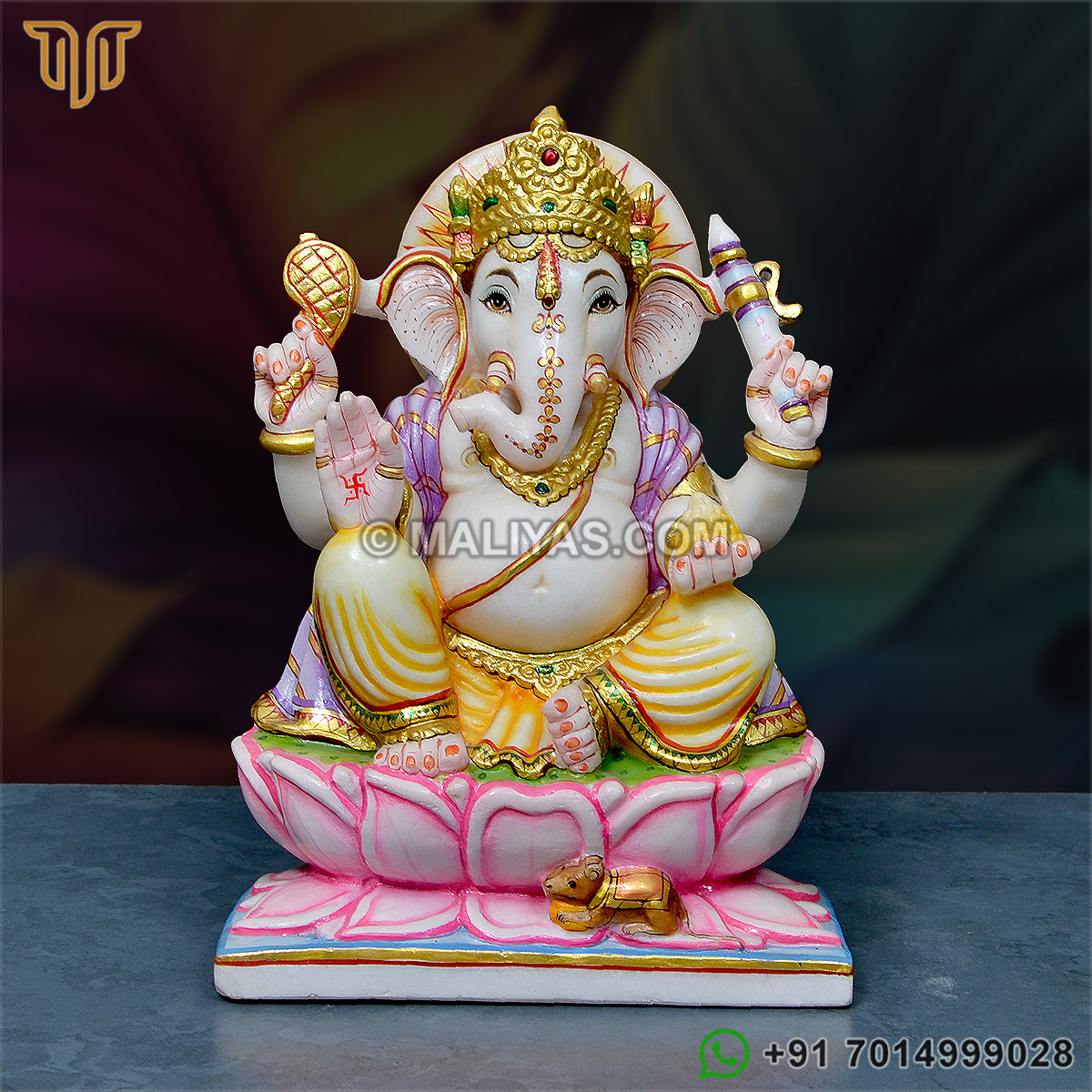Marble Ganesh Murti sitting on lotus