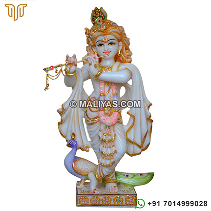 Lord krishna murti with peacock