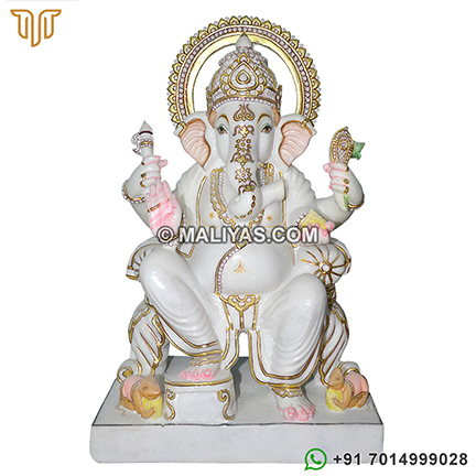 Marble ganesha sitting on singhasan